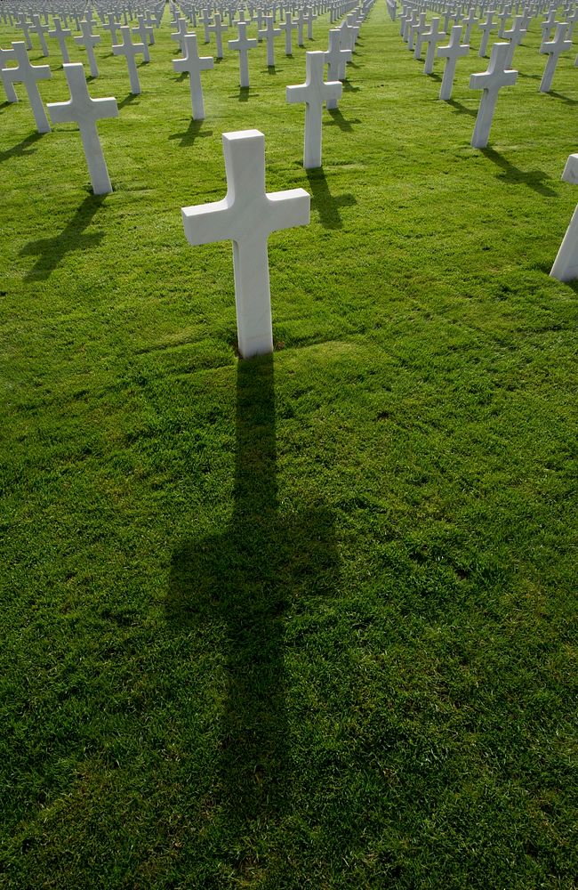 A shadow is cast from a U.S. Military member&rsquo;s gravestone during a Veterans Day event at the Luxembourg American…