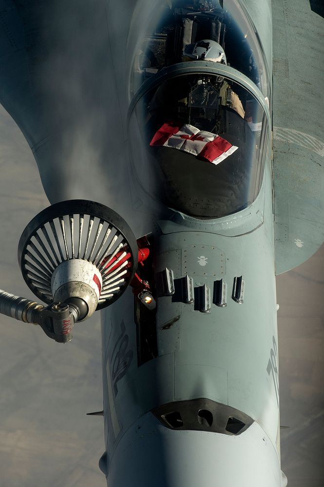 An U.S. Air Force KC-135 Stratotanker from the 340th Expeditionary Air Refueling Squadron refuels a F-18 from the Royal…