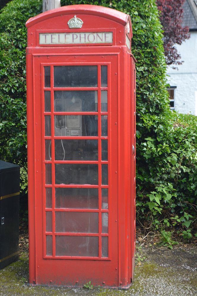 Red telephone booth. Free public domain CC0 photo.