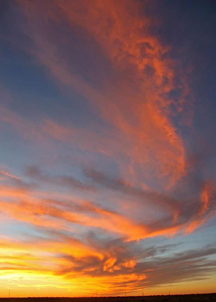 Sunset Over the GrasslandCredit NPS. Original public domain image from Flickr