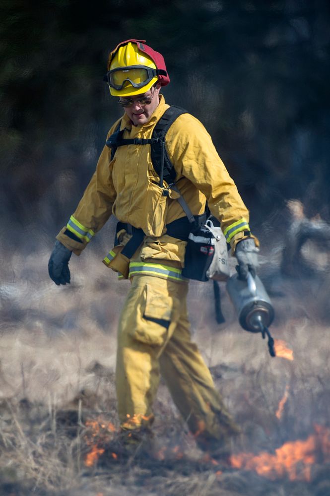 U.S. Air Force Senior Airman Grant Kopplin, a fire protection specialist assigned to the 673d Civil Engineer Squadron, uses…