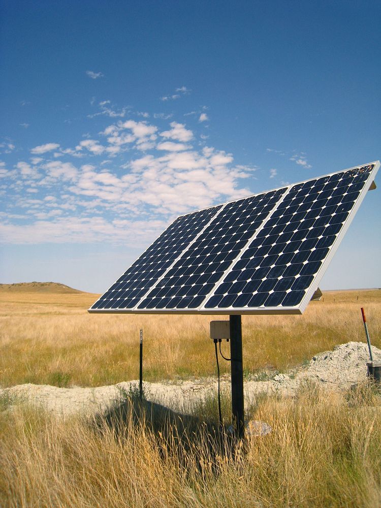 An installed solar panel providing water to distribute livestock grazing, improving plant health. Plevna, MT. July 2012.…