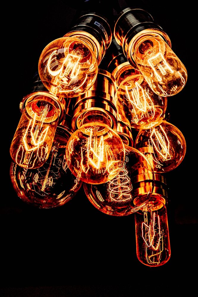 Light bulbs on black background. Free public domain CC0 photo.