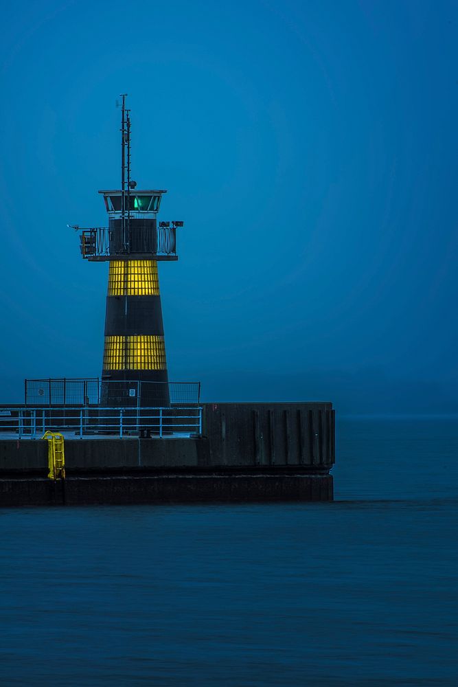 Lighthouse in middle of ocean. Free public domain CC0 image. 