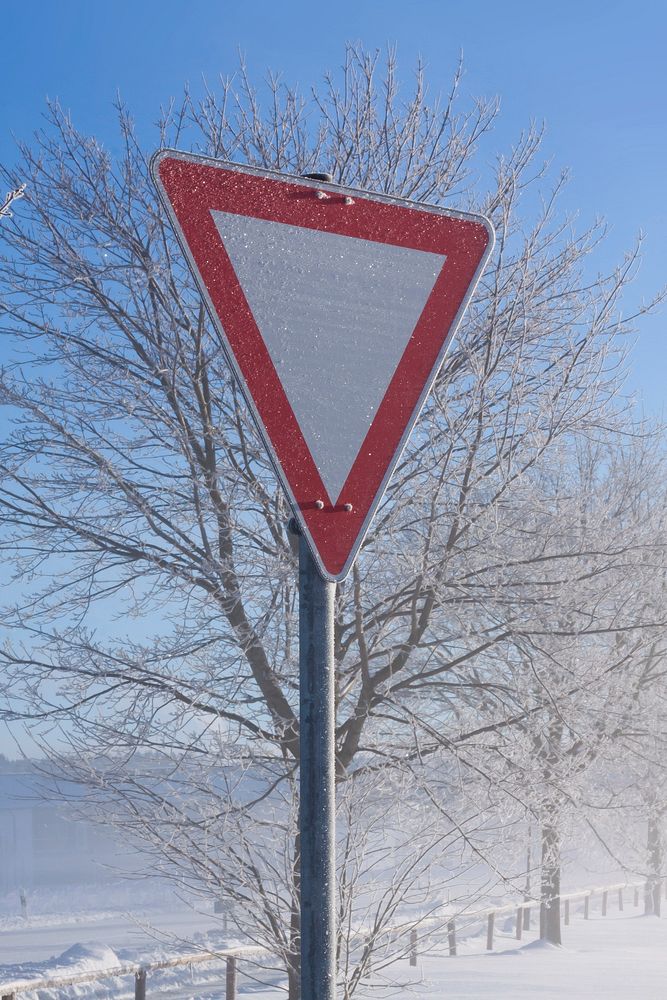Closeup on road sign during winter. Free public domain CC0 photo.