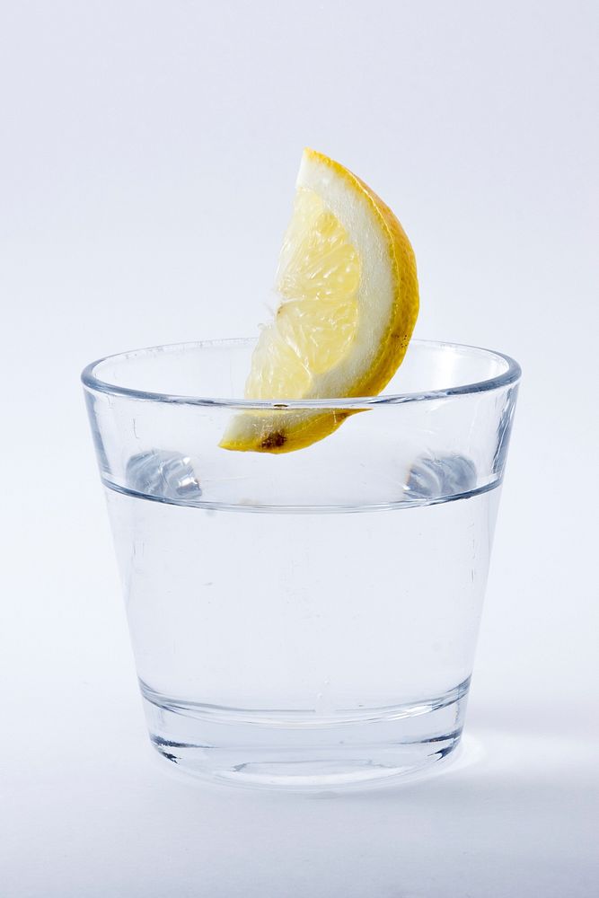 Glass of water & lemon slice. Free public domain CC0 image