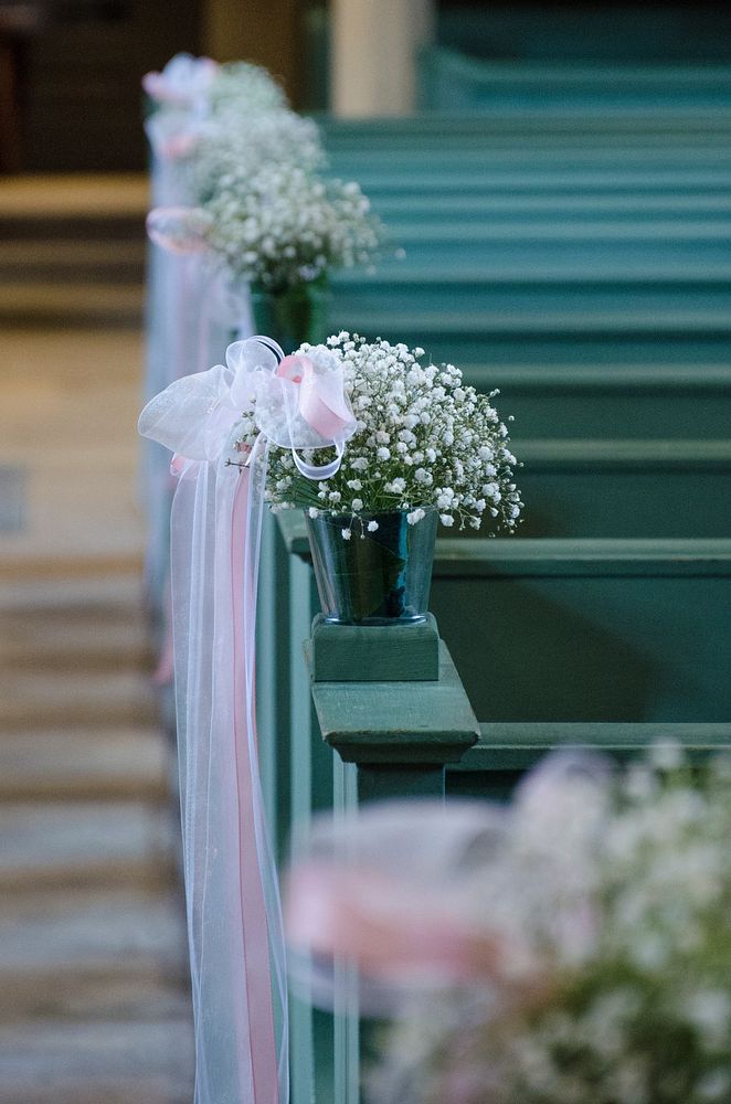 Flowers on pews. Free public domain CC0 image.