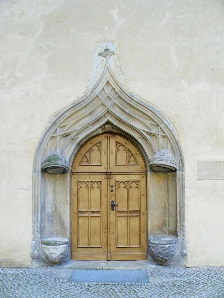 Old arched wooden door. Free public domain CC0 photo.