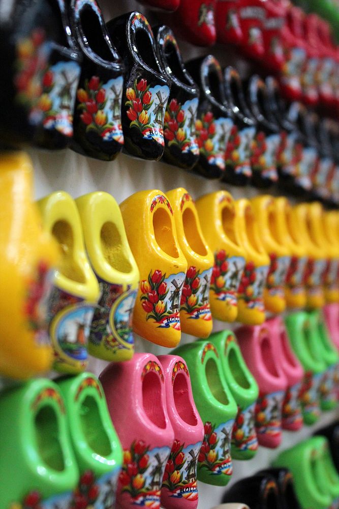 Different colorful clogs on a rack. Free public domain CC0 image