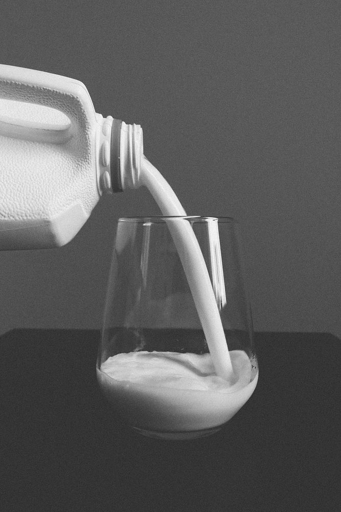 Butter milk pourin in a glass. Free public domain CC0 image