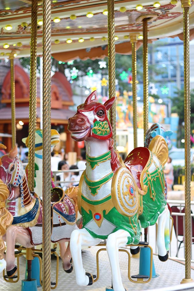 Carousel at amusement park. Free public domain CC0 photo.