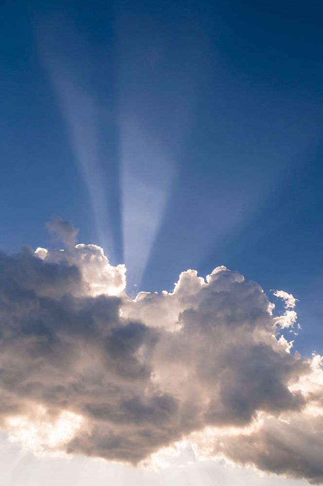 Cloudy sky background, sunbeam. Free public domain CC0 image.