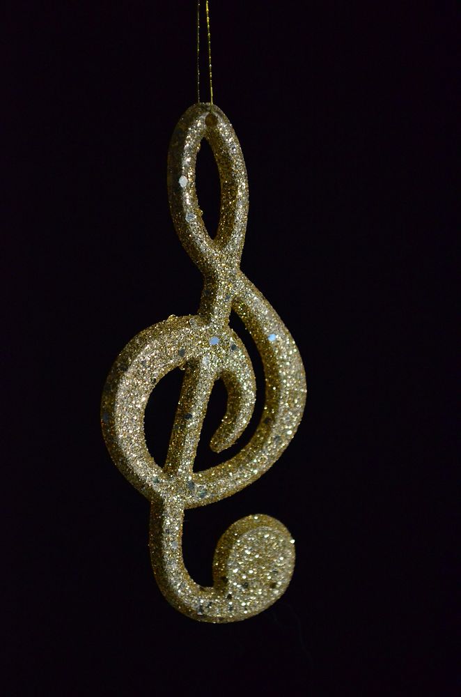 Closeup on gold music note ornament. Free public domain CC0 photo.
