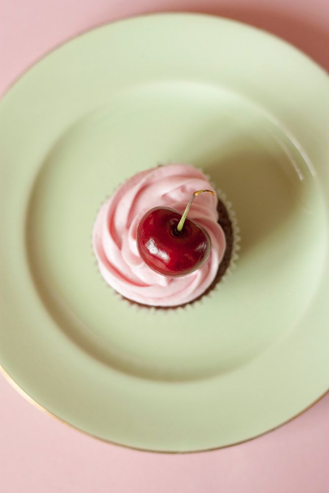 Chocolate cupcake with cherry on top. Free public domain CC0 photo.