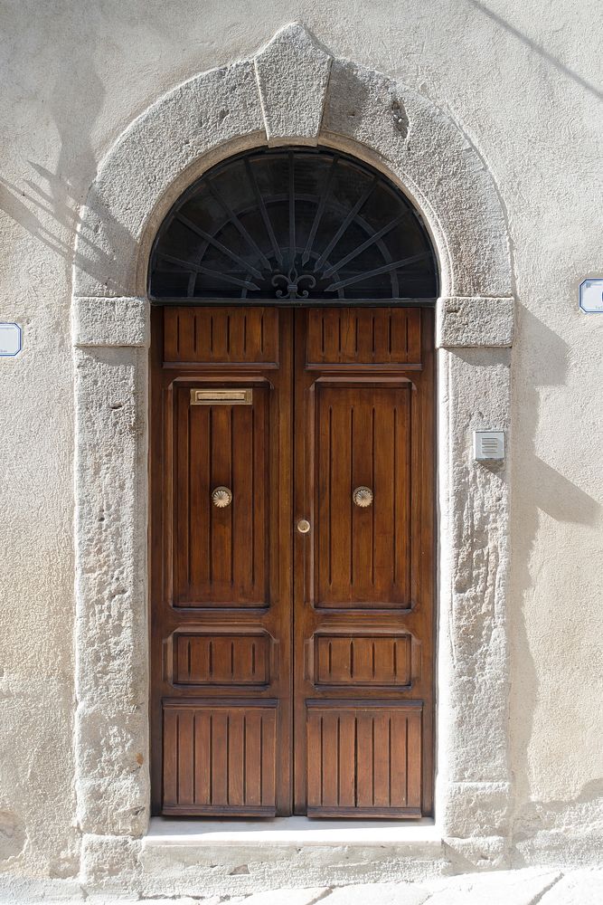 Arched wooden door, architecture. Free public domain CC0 photo.