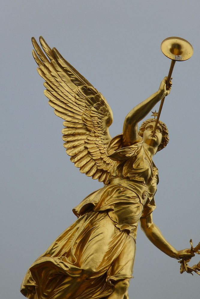 Statue of goddess of Fama or Pheme, Academy of Art in Dresden, Saxony, Germany. Free public domain CC0 photo.