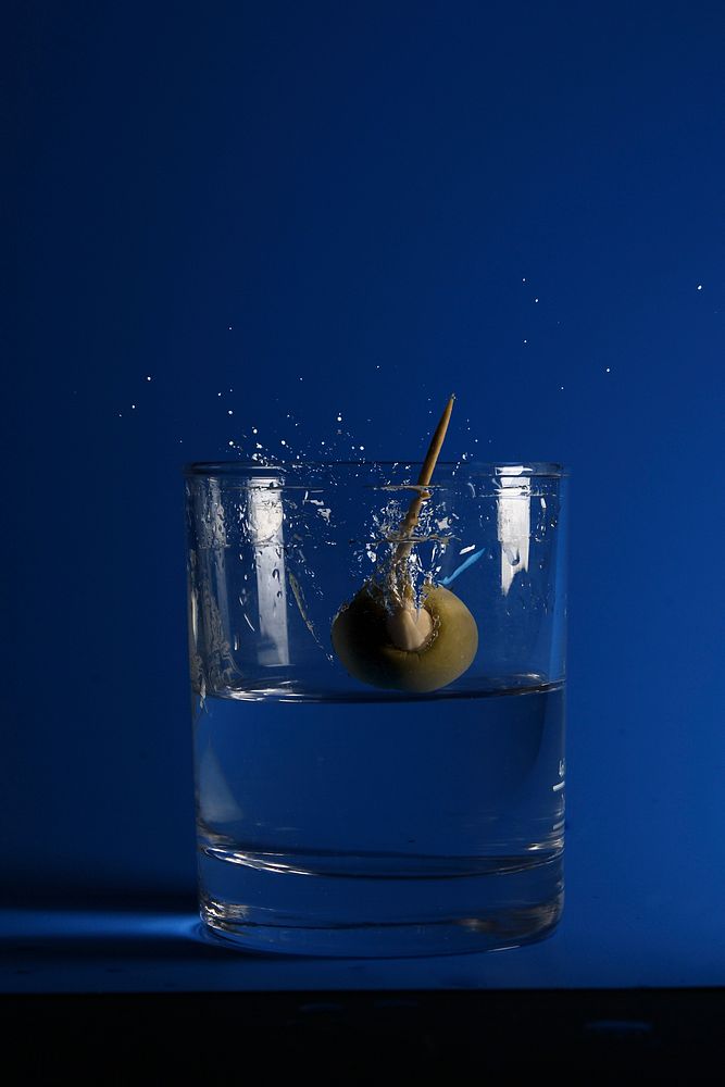 Cocktail drink with olive. Free public domain CC0 image