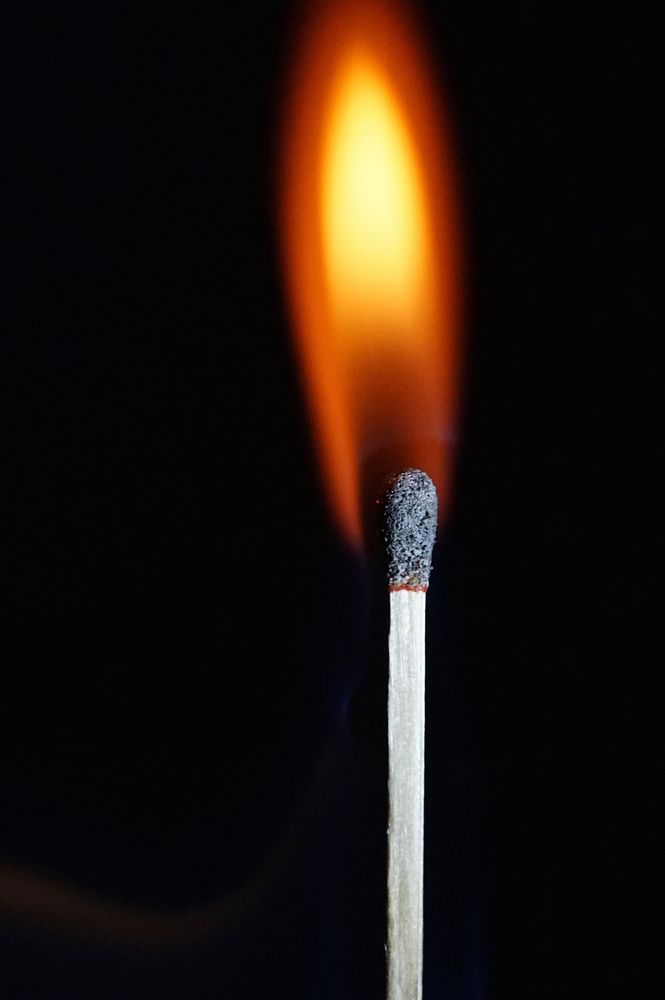 Match with flame, background photo. Free public domain CC0 image.