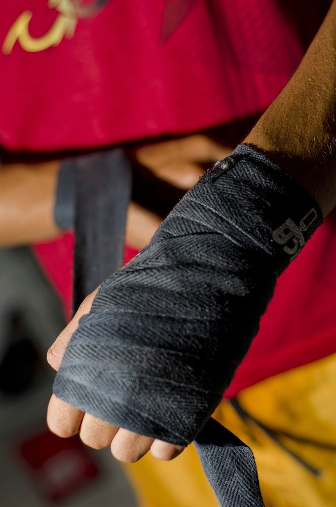 Boxer putting on bandage. Free public domain CC0 photo.