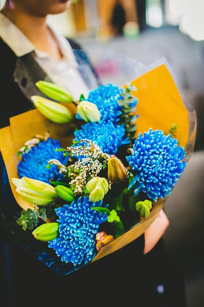 Woman and blue flower bouquet. Free public domain CC0 image.
