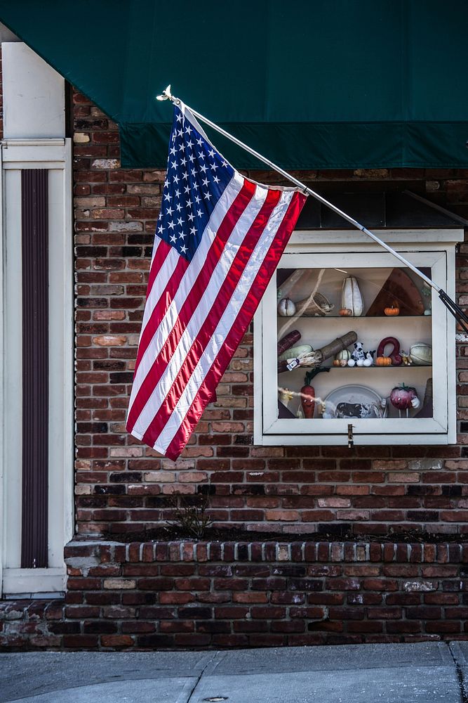 American flag in house facade. Free public domain CC0 photo.