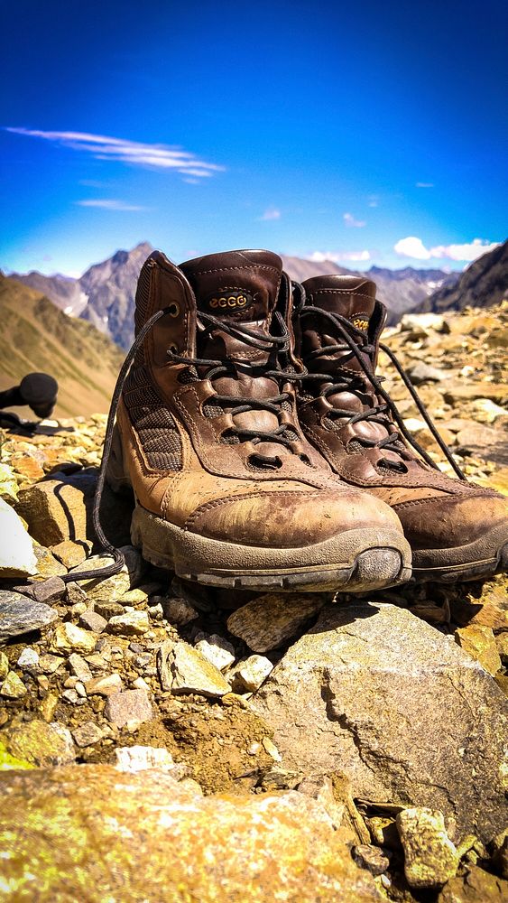 Hiking shoes on a ground. Free public domain CC0 image.