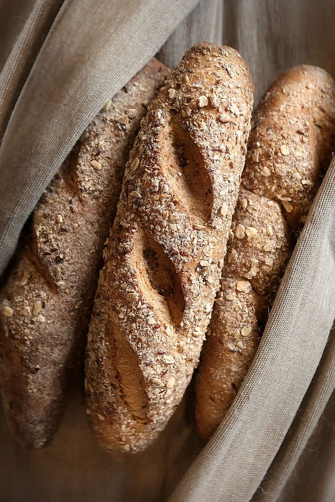 Free three baguette bread in sackcloth grocery bag image, public domain food CC0 photo.