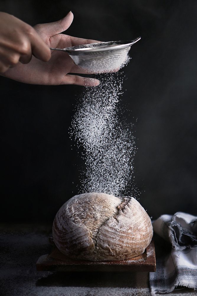 Free baker after baking fresh bread sprinkles sugar powder on bread with a cup powder flour sieve image, public domain food…