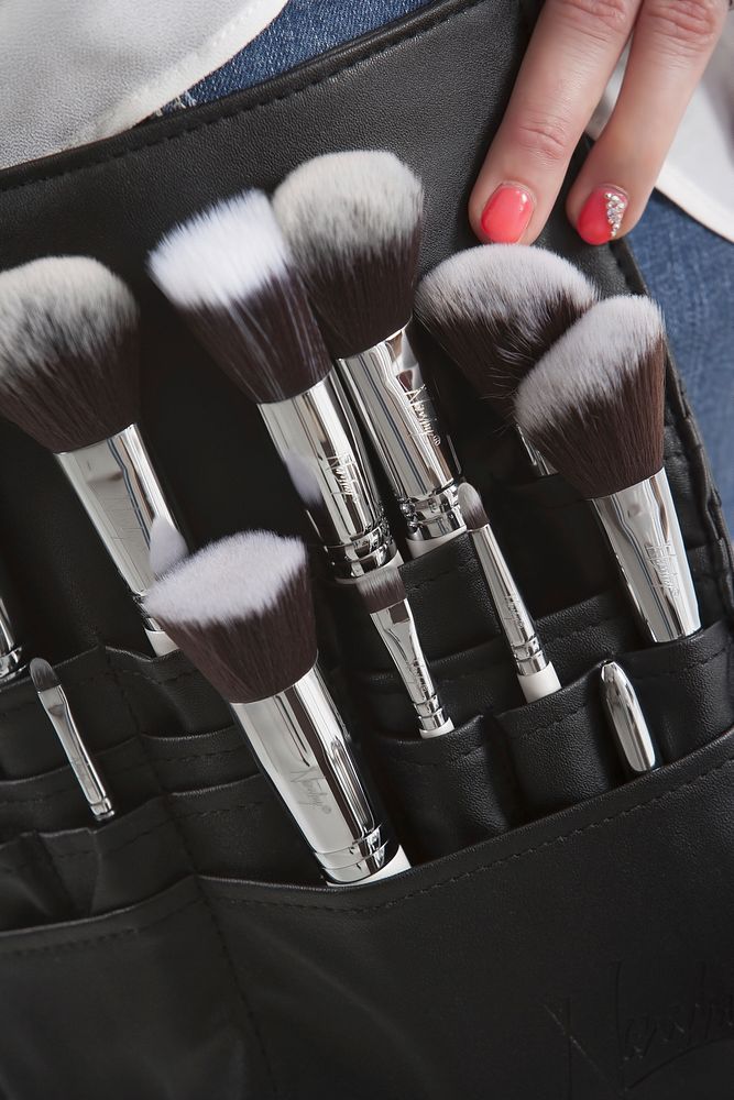 Makeup artist with brushes. Free public domain CC0 photo.
