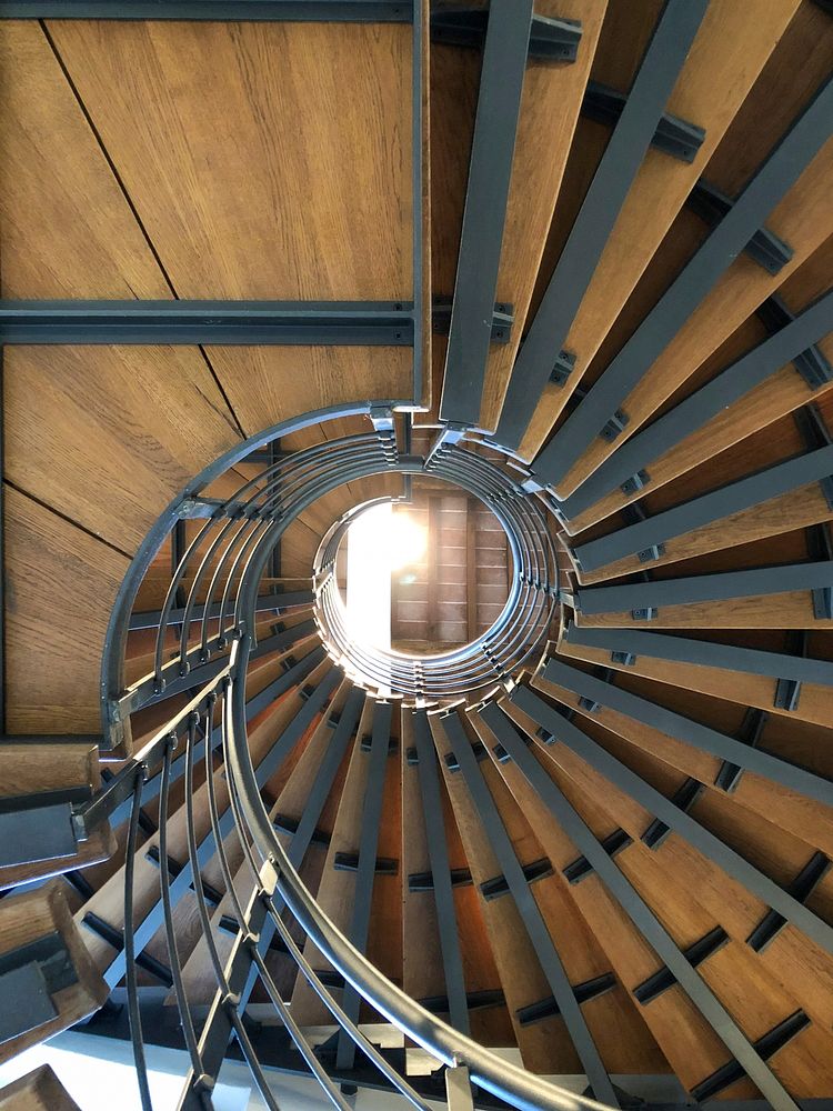 Interior view of building with wooden spiral staircase