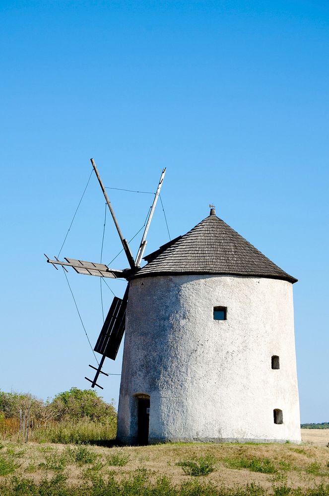 Old windmill in countryside. Free public domain CC0 image.