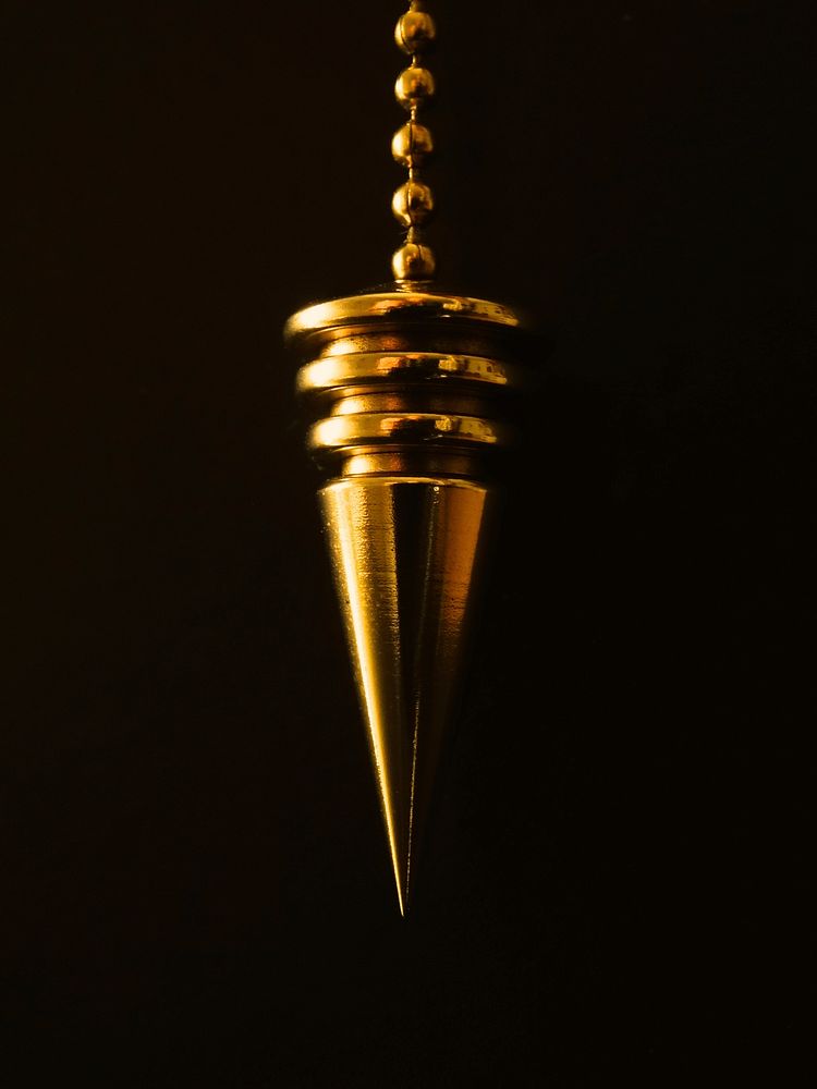 Gold pendulum chain. Free public domain CC0 photo.