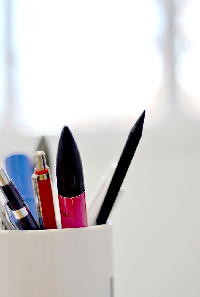 Pencil cups, stationery on desk. Free public domain CC0 photo.