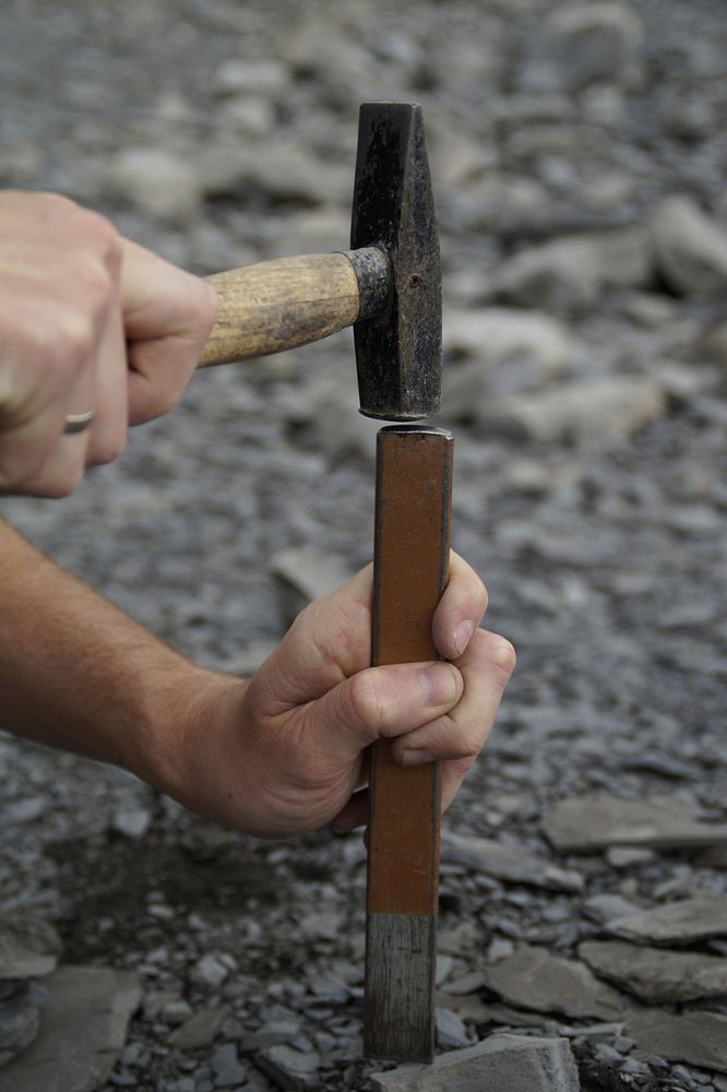 Man hammering, manual job. Free public domain CC0 photo.