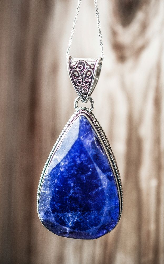 Shiny blue stone pendant jewelry. Free public domain CC0 photo.