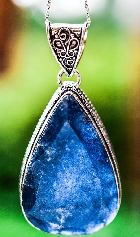 Shiny blue stone pendant jewelry. Free public domain CC0 photo.