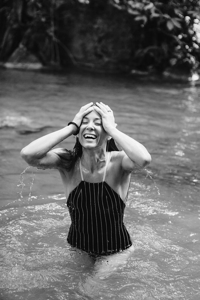 Beautiful woman at a waterfall