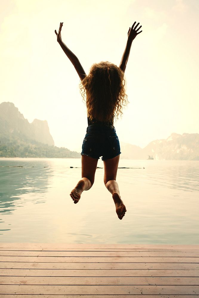 Happy woman jumping with joy
