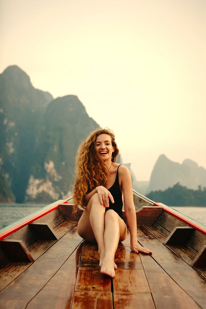 Beautiful woman posing on a boat