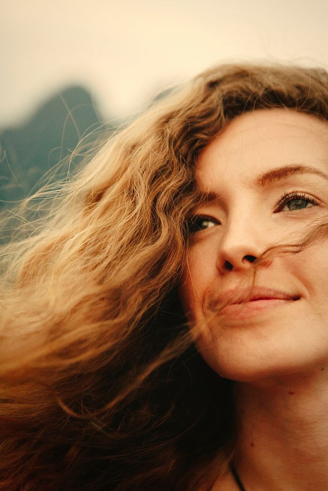 Portrait of a beautiful woman with curly hair