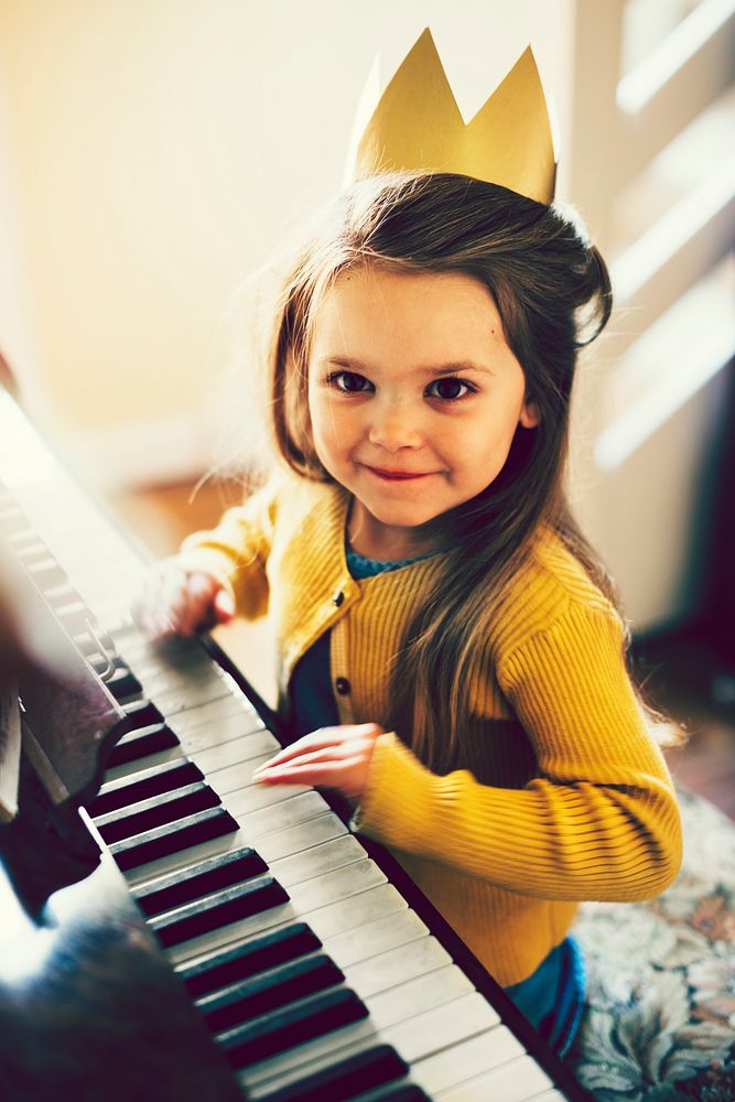 Cute girl playing the piano