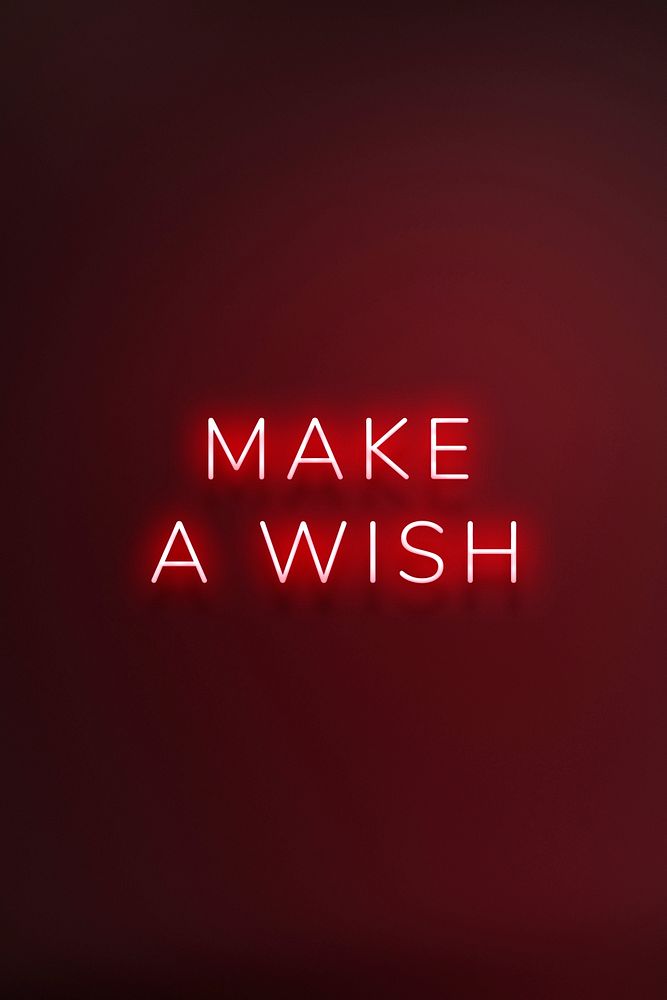 Glowing make a wish neon typography on a red background