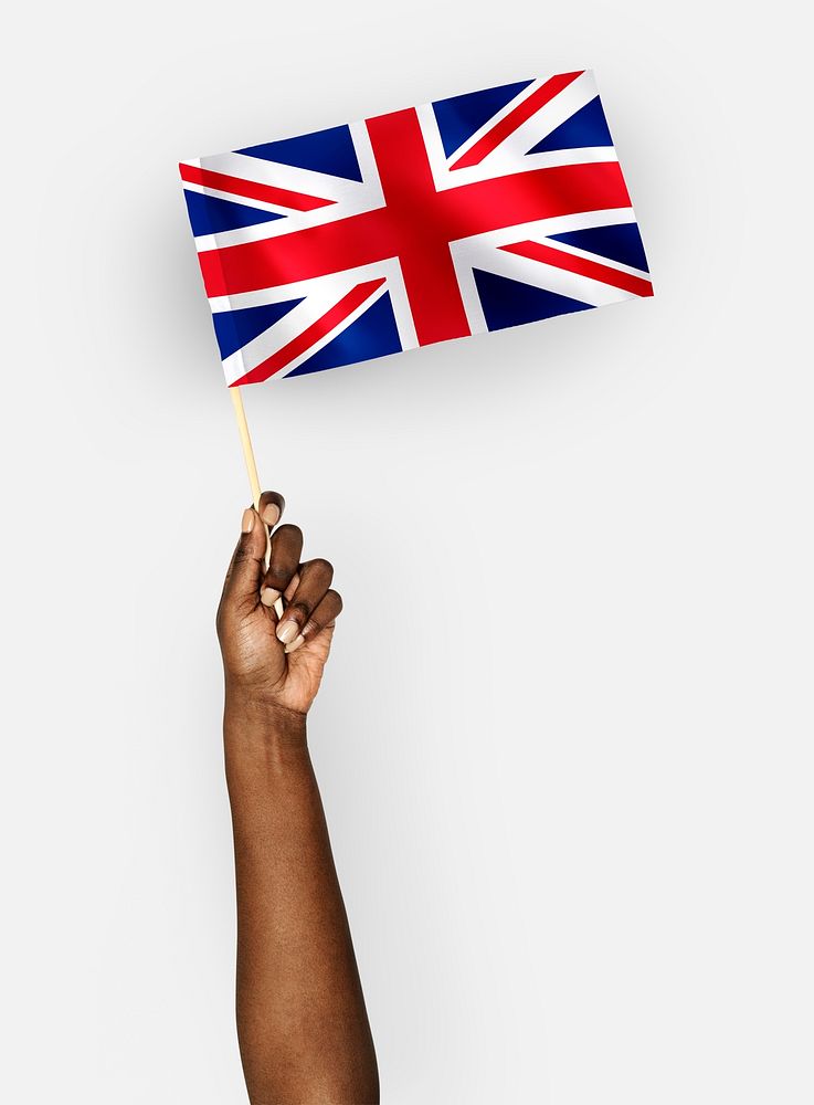 Person waving the flag of United Kingdom of Great Britain and Northern Ireland