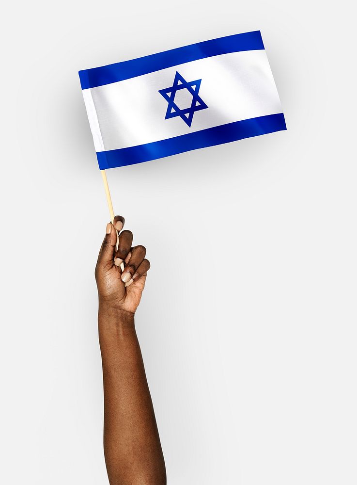 Person waving the flag of State of Israel