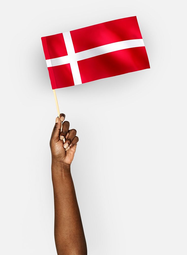 Person waving the flag of Kingdom of Denmark