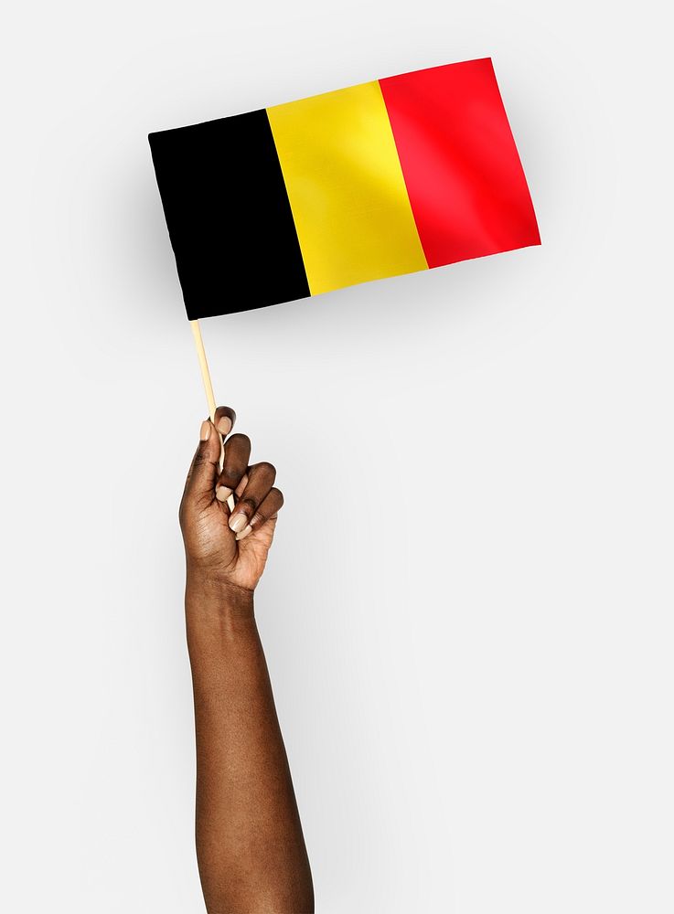 Person waving the flag of Kingdom of Belgium
