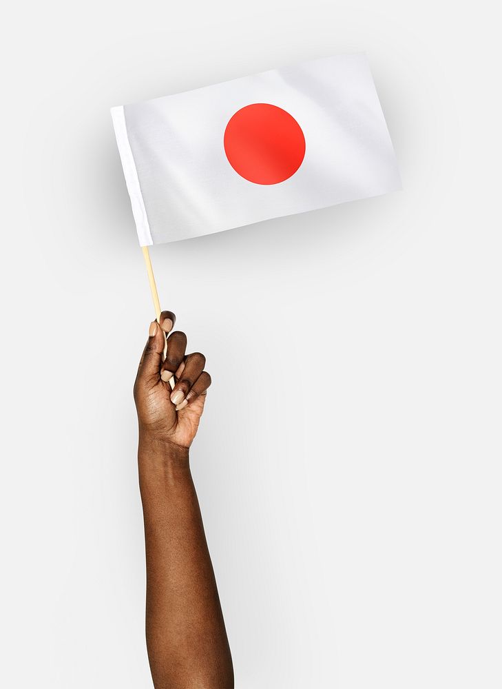 Person waving the flag of Japan