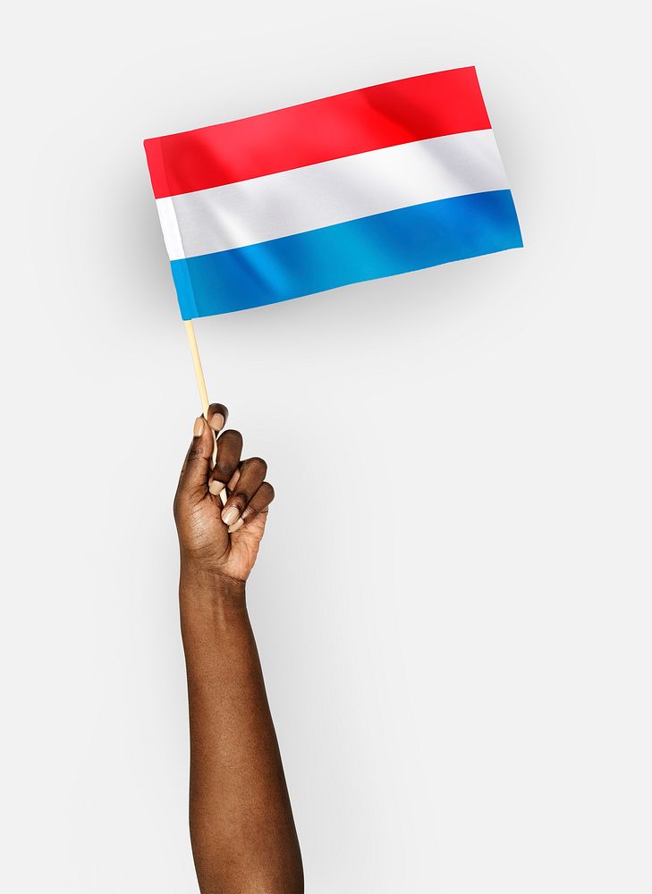 Person waving the flag of Grand Duchy of Luxembourg