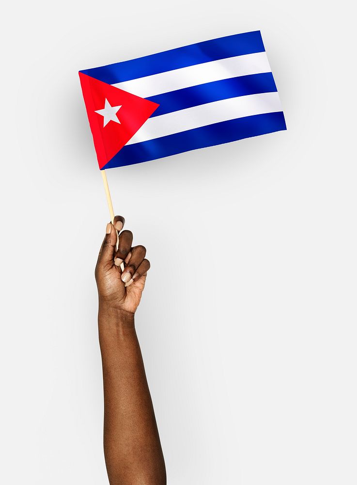 Person waving the flag of Republic of Cuba