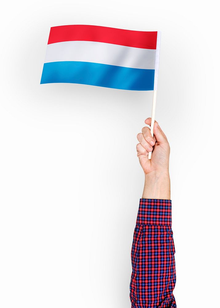 Person waving the flag of Grand Duchy of Luxembourg